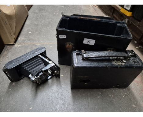 Two vintage Kodak cameras, one with case.