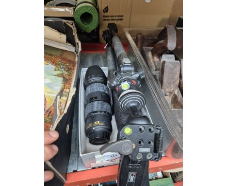 A Nikkor AF-S 70-200mm 1:4G Ed zoom lens, Canon flash, and a Manfrotto 190X Pro B tripod with ball grip