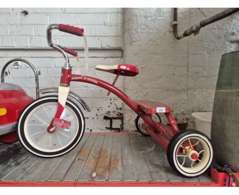 A child's Radio Flyer tricycle 