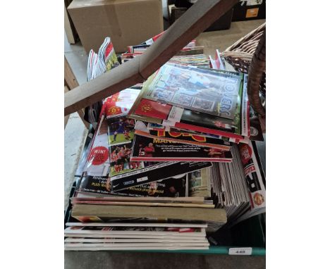 A box of sport memorabilia including football programmes, books, magazines and ephemera.