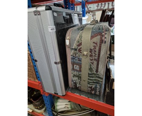 A Route 66 case containing a Toyota overall and a Pirelli overall and an aluminium display case.