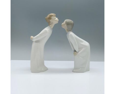 Lladro Porcelain Figurine, Kissing Girl 1004873 and Boy 1004869. A glazed porcelain figurine featuring a girl and a boy, both