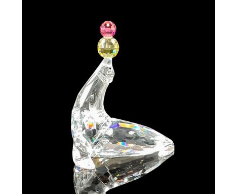 Part of the Cheerful Times series. Clear crystal figural with jet inset eyes, balancing yellow and pink crystal balls. Swarov