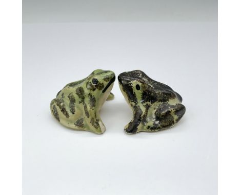 Two hand-painted ceramic frogs featuring a charming blend of green and brown hues, crafted in a simplistic design. Issued: 20