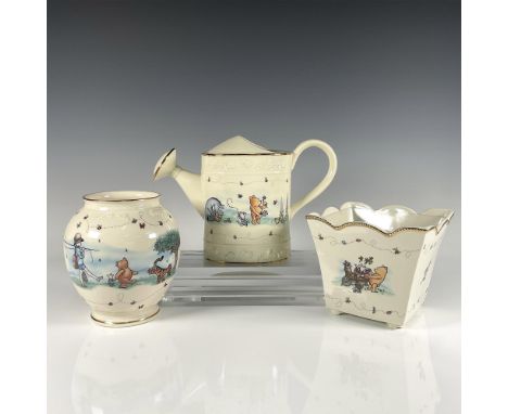 Three sweet cream colored garden vessels with gilded accents including 1 watering can titled A Pooh-ish Sort of Garden, 1 pla