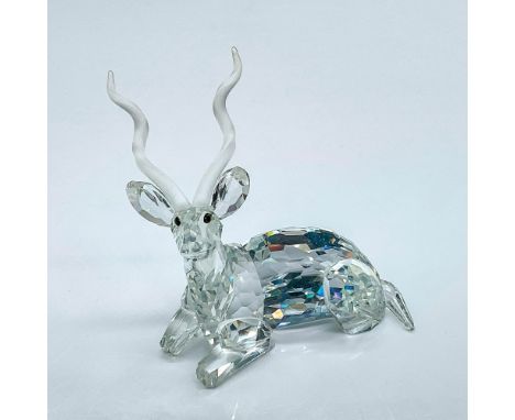 Multifaceted clear crystal gazelle, part of the 1994 Inspiration Africa the Kudu with black eyes and frosted horns in a resti