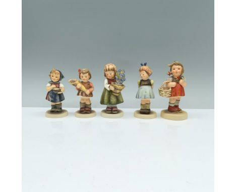 This delightful set features 4 Goebel Hummel figurines that includes a girl holding a potted blue flower that is signed, anot