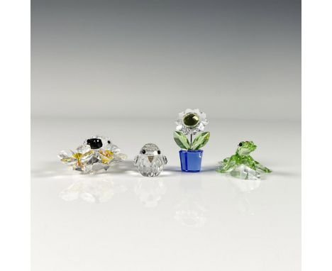Lead crystal garden themed figures including a sparrow, lady bug on flower, a sunflower, and a charming green gecko. Made fro