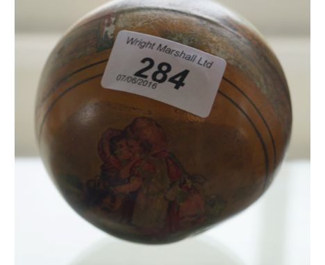 A late 19th/ early 20th Century tourist ware ball
Entitled a present from Llandudno, depicting two children playing and views