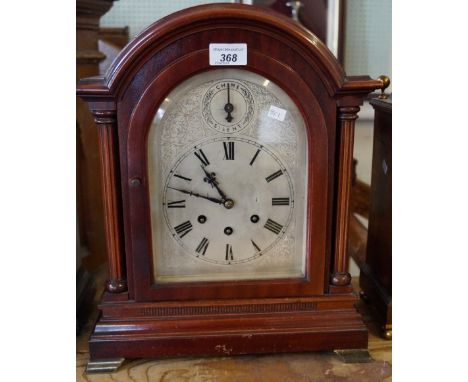 An ealry 20th Century mantel clock, raised on bracket support