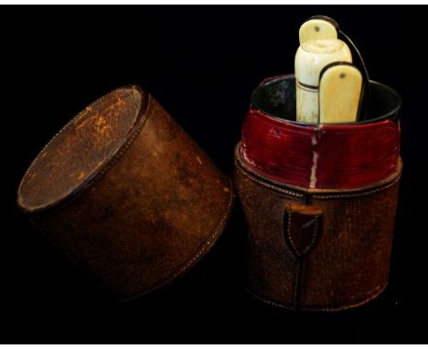 A late 19th Century campaign barrel, leather, with fitted interior comprising of a folding fork and spoon with a central bone