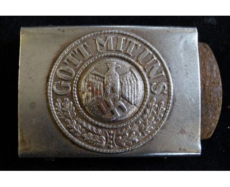 A World War II Nazi Germany army soldiers belt buckle with eagle and swastika emblem.