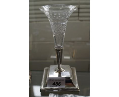 A Sheffield hallmarked silver and cut glass posy holder, a Birmingham hallmarked silver pin cushion, a Georgian caddy spoon e