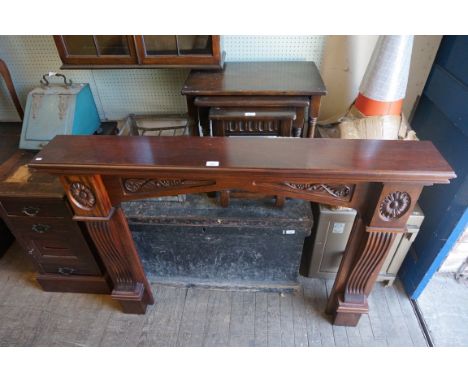 A stained hardwood fire surround.