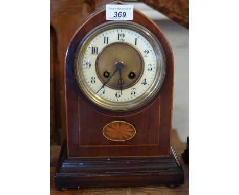 An Edwardian inlaid mantel clock.