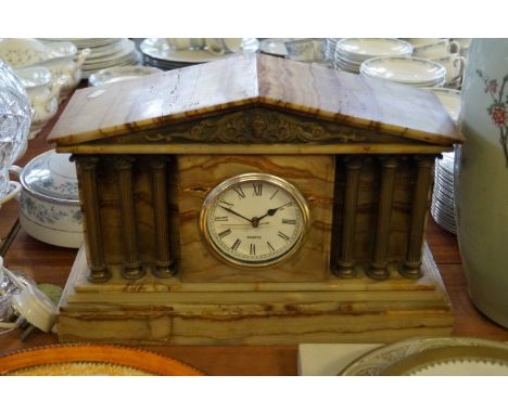 A stylish onyx mantel clock, with corinthian column supports