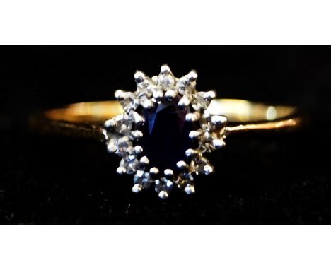 An amethyst and diamond cluster ring to a 9ct gold shank, weight 2.3g