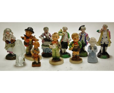 A small collection of assorted continental porcelain figures to include Goebel musicians etc