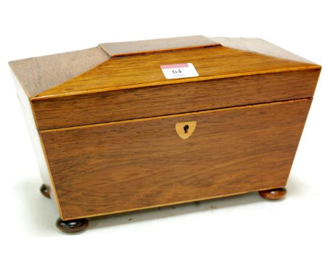 A Regency rosewood tea caddy, of sarcophagus form on bun feet