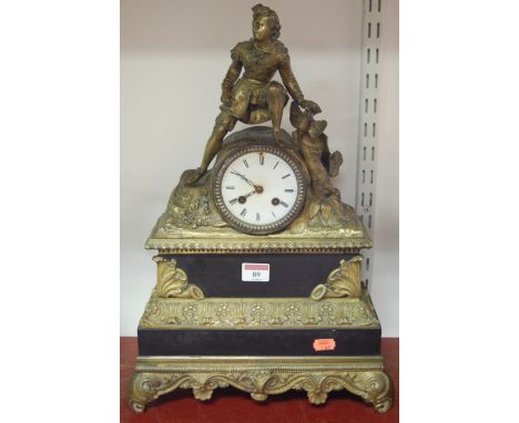A 19th century French marble gilt metal mantel clock having an enamel dial with Roman numerals and cylinder movement surmount