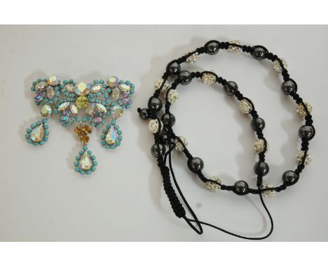 A ladies Christian Dior white metal, turquoise, and paste set brooch, boxed, together with a Tresor of Paris ladies necklace