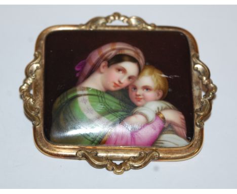 A 19th century continental yellow metal brooch, enamel decorated with the Madonna and Child 