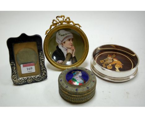 An eastern brass trinket jar and  cover, the hinge lid enamel decorated with a portrait of a lady, together with a painted po