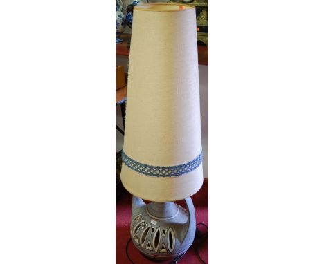 A large 1970s stoneware floor standing lamp having conical shade