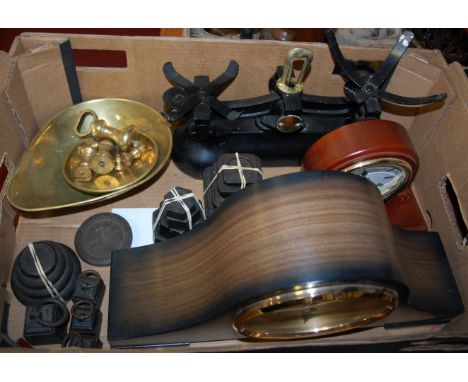 A box of miscellaneous items to include various scales and weights, reproduction cast iron door stop, modern mantel clock etc