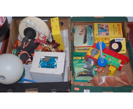 Two boxes of miscellaneous toys and games to include tinplate toy locomotive, Pink Panther lamp, Smurf figure etc