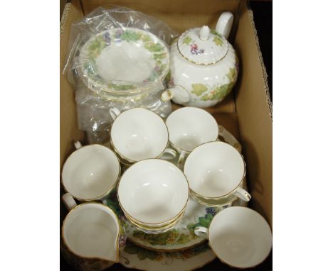 A Royal Worcester eight place setting tea service in the Vine Harvest pattern