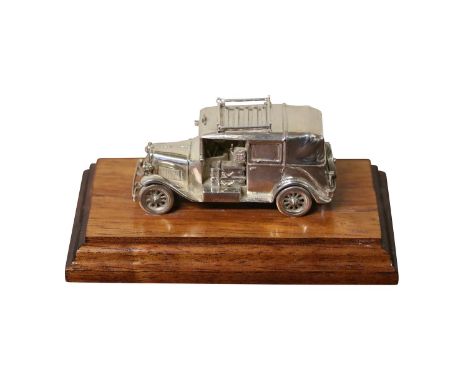 1996 cast silver car on a wooden plinth by R&amp;H 