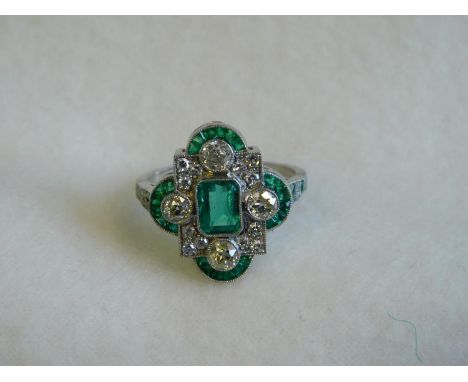 Platinum ring set with a central emerald-size N 