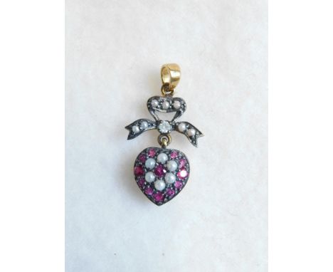 Heart shaped bow pendant set with rubies, diamonds and seed pearls 