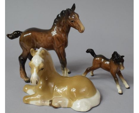 A Beswick Shire Foal, Brown Beswick Foal and a Szelier Reclining Foal (Condition issues to include legs sf etc) 