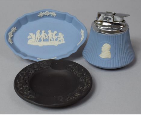 A Wedgwood Jasper Winston Churchill Table Lighter, Black Basalt Ashtray and Blue and White Jasperware Pin Tray 