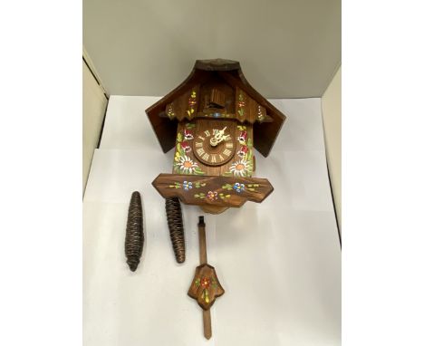 A CUCKOO CLOCK - VENDOR STATES WORKING ORDER, NO WARRANTY GIVEN