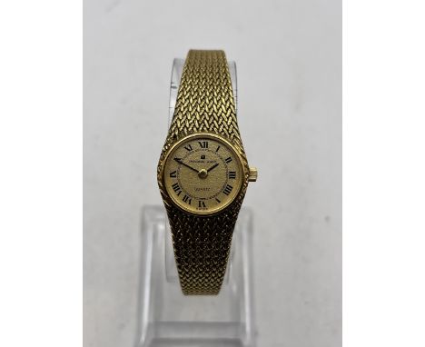 A VINTAGE UNIVERSAL GENEVE QUARTZ GOLD PLATED BANGLE WRIST WATCH