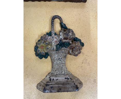 A HUBLEY FLORAL CAST IRON DOOR STOP