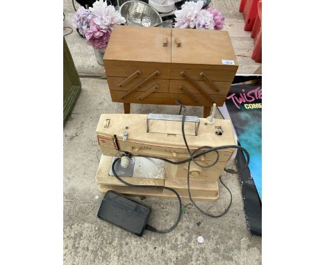 A MAGIC ELECTRIC SEWING MACHINE AND A CONCERTINA SEWING BOX