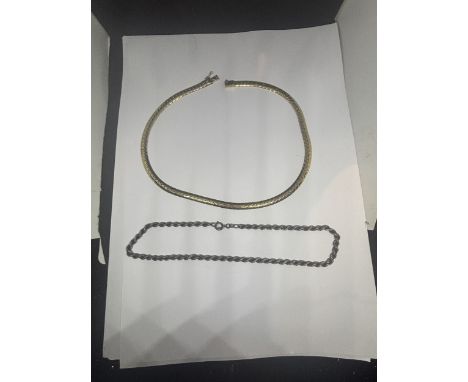TWO SILVER NECKLACES TO INCLUDE A SILVER GILT CHOKER AND A ROPE DESIGN
