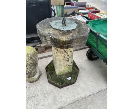 A CONCRETE GARDEN SUNDIAL WITH BRASS GNOMON