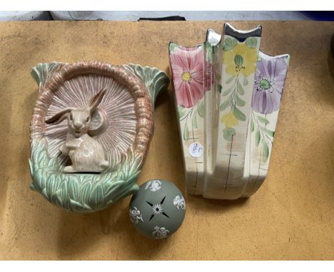 AN ARTHUR WOOD ART DECO WALL POCKET HANDPAINTED WITH FLOWERS AND FOLIAGE - 23.5 CM TOGETHER WITH A SYLVAC RABBIT WALL POCKET 