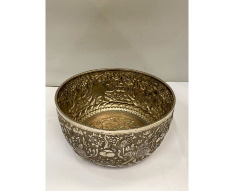 A CAMBODIAN WHITE METAL BOWL WITH REPOUSSE DECORATION FIGURAL WITH ELEPHANTS AND FOLIATE SCROLLWORK - 22 CM (D) 11 CM (H)
