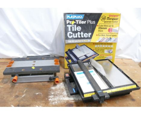 Boxed PlasPlugs pro-tiler plus tile cutter 240v measuring 39cm square and a Black & Decker jobber workmate measuring approx 3