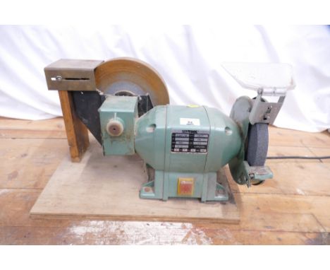 NuTool wet stone bench grinder on wooden stand.