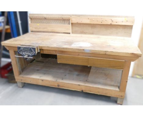 Heavy duty wooden scratch built workshop bench, with 2 drawers, under shelf and back panel for tool storage. Bench includes a