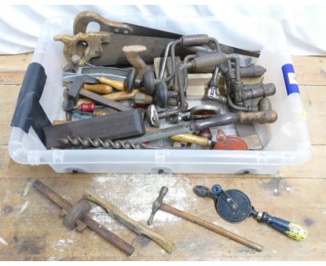 Mixed lot of vintage woodworking hand tools that include spoke shaves, ratchet drills, hand saws etc.