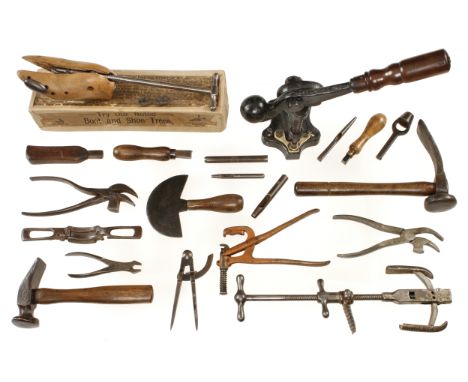 An eyelet setting machine, a shoe stretcher with accessories in orig box with instructions on lid, another of different desig