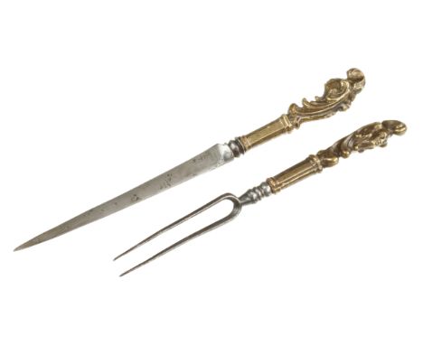 A rare pair of 18c French knife and fork with elaborately decorated brass handles with human and monkey faces G++
